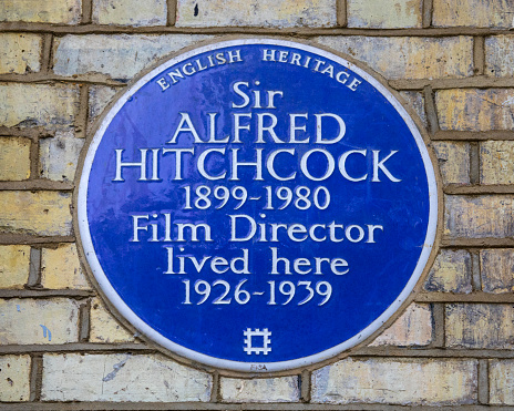 London, UK - May 5th 2022:A blue plaque on Cromwell Road in South Kensington, London, marking the location where famous Film Director Sir Alfred Hitchcock once lived.