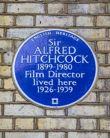 London, UK - May 5th 2022:A blue plaque on Cromwell Road in South Kensington, London, marking the location where famous Film Director Sir Alfred Hitchcock once lived.