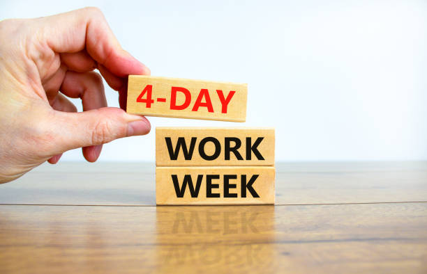 4-day work week symbol. Concept words 4-day work week on wooden blocks on beautiful white background. Businessman hand. Copy space. Business and 4-day work week and short workweek concept. stock photo