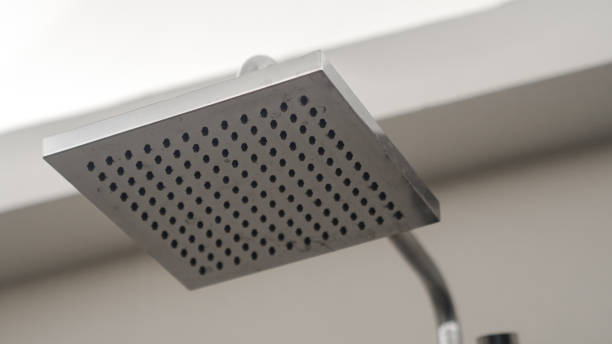 istock shower head and modern bathroom faucet. 1397229145