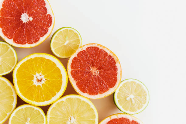 istock Sliced citrus fruits such as grapefruit, orange, lemon and lime on white background 1397230351