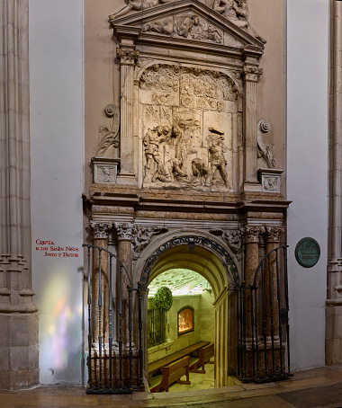 Alcala de Henares, Spain - May 13, 2022. Entrance to the crypt of Saints Justo and Pastor on the retrochoir of the Alcala de Henares Magistral Cathedral. Region of Madrid, Spain.