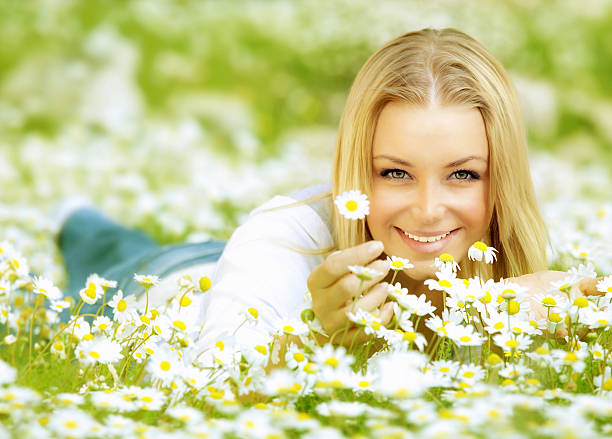 istock Beautiful girl enjoying daisy field 139723361