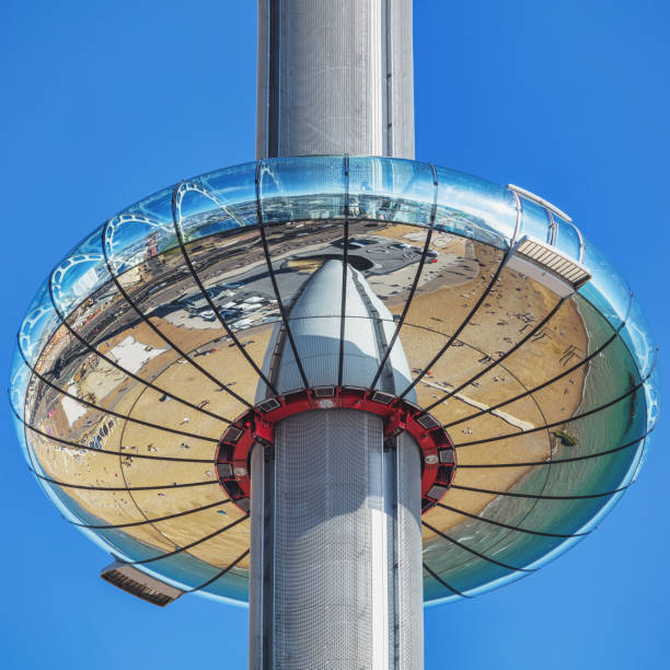 Brighton, UK - Jun 09, 2021: the reflective people-carrying pod of the British Airways i360 tower alongside a dazzling blue summer sky in Brighton, UK. The tower elevates people to stunning views of the famous British seaside town.