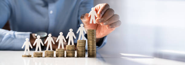 istock Human Hand Placing Human Figure On Increasing Stacked Coins 1397234864
