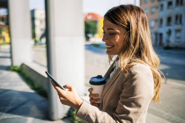 istock Businesswoman text messaging o a coffee break 1397237054