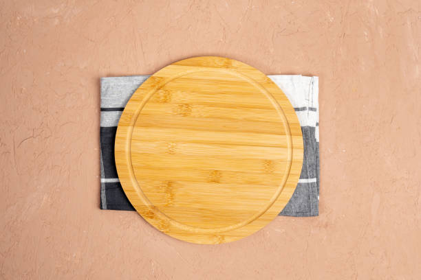 istock Round cutting boards. On a brown background. Top view. 1397237060