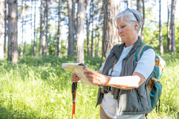 istock Woman reading a map on a hike 1397237099