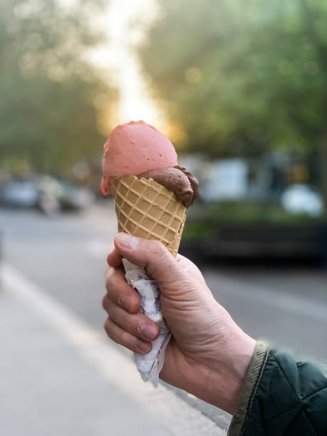 istock Male hand holding cone ice cream 1397237409