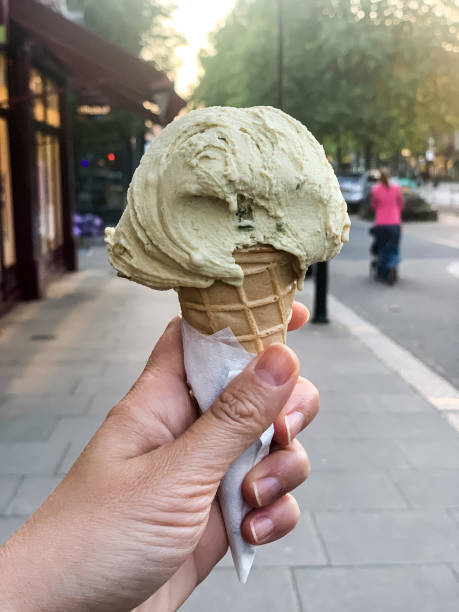istock Female hand holding cone ice cream 1397237426