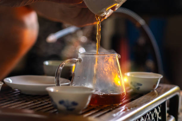 istock Tea ceremony, pours tea close-up, selective focus, brewing Chinese tea the original method. 1397237438