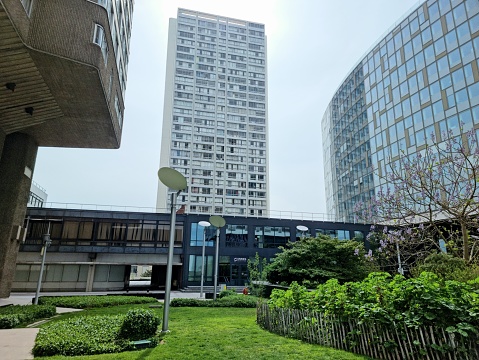 Front de Seine  in Paris is a residential district with many tall buildings. It is part of the Beaugrenelle District located along the river Seine in the 15th arrondissement. The image shows the Tour Avant-Seine(1975): 98 m, 32 storeys, captured during springtime.