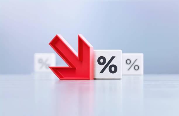 istock Red Down Arrow And Percentage Sign Written White Cubes Sitting Before Defocused  Background 1397238411