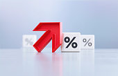 Red Up Arrow And Percentage Sign Written White Cubes Sitting Before Defocused  Background
