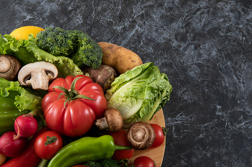Various fresh vegetables on kitchen table