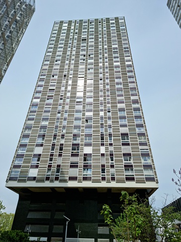 Front de Seine  in Paris is a residential district with many tall buildings. It is part of the Beaugrenelle District located along the river Seine in the 15th arrondissement. The image shows the Tour Avant-Seine(1970): 98 m, 32 storeys, captured during springtime.