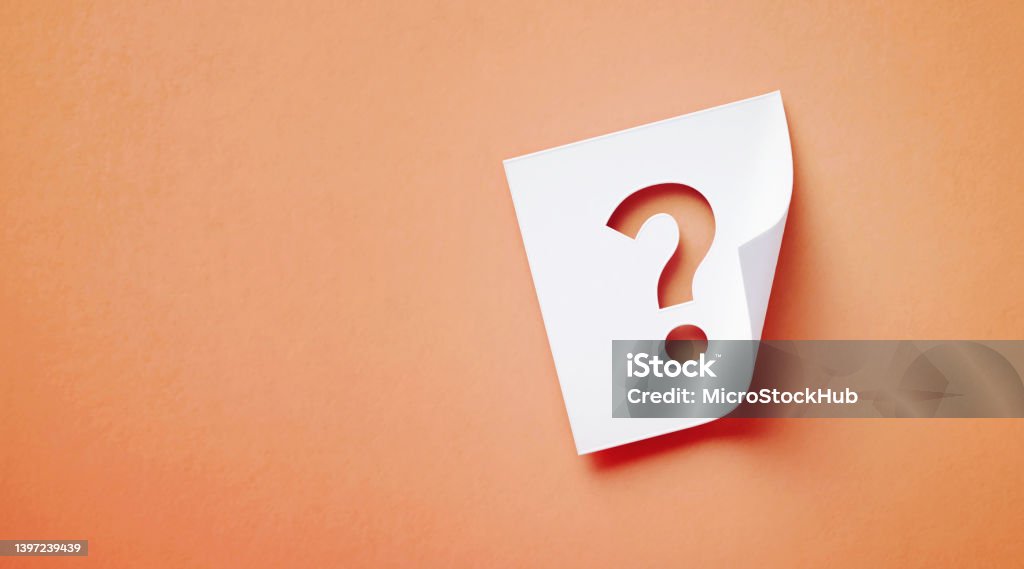 White Adhesive Note With Cutout Question Mark Sitting Over Orange Background White adhesive note with cutout question mark sitting on orange background. Horizontal composition with copy space. Question Mark Stock Photo