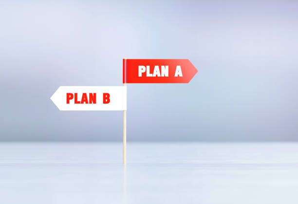 istock Plan A And Plan B Written Red And White Directional Signs Sitting On Silver Reflective Surface  Before Silver Defocused Background 1397241380