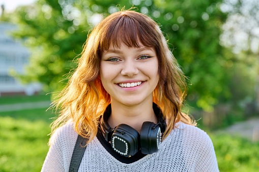 Portrait of an attractive young woman enjoying a spring day outdoors