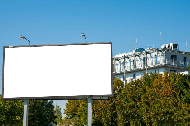 istock Advertising billboard mockup with modern building in the background 1397245794