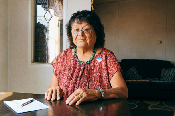 istock Woman Voting With a Mail In Election Ballot 1397246957