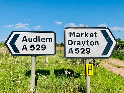 Road signs showing direction to Audlem and Market Drayton, Cheshire, England, U.K.