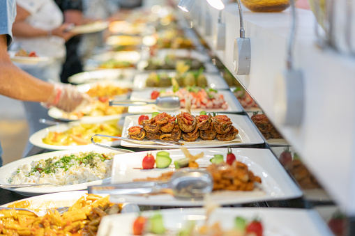 Buffet food, catering food party at restaurant, mini canapes, snacks and appetizers .
