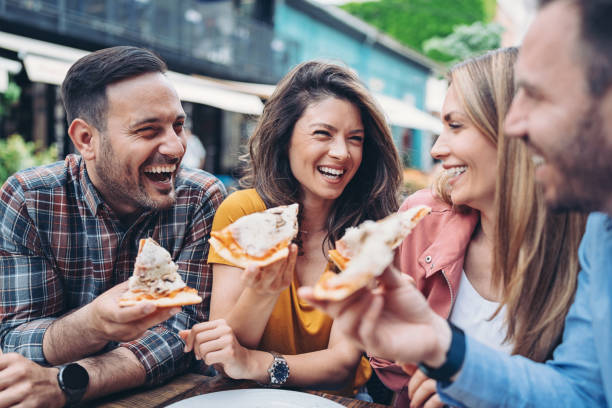 istock Friends enjoying pizza together 1397250494