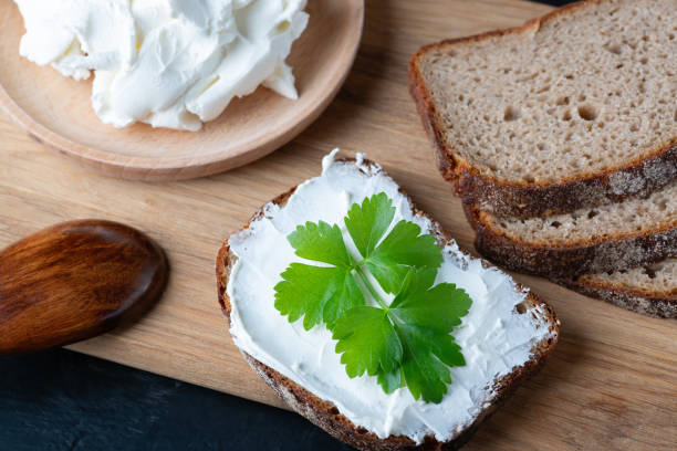 istock Home made bread on a wooden cutting board with curd cheese and ricotta 1397251077