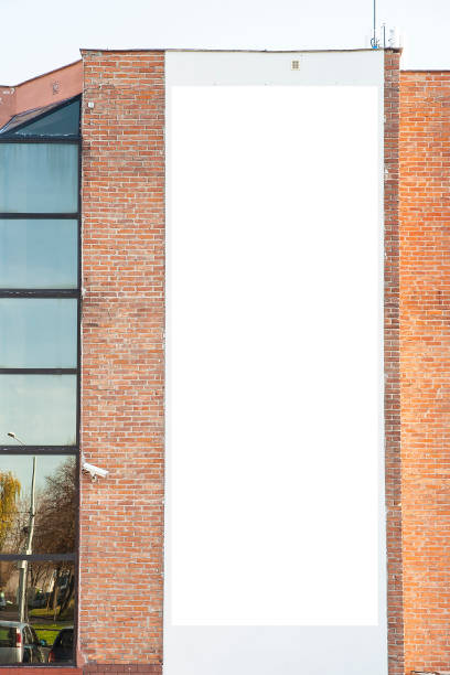 istock Blank vertical advertising banner on the wall 1397252287