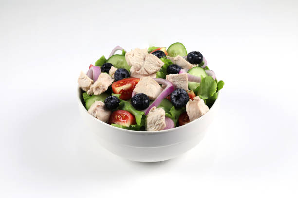 istock Mixed vegetable salad with boiled chicken breast in a bowl. 1397253341