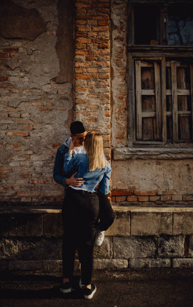 istock Romantic couple leaning on the wall 1397259356