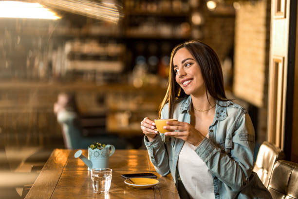 istock Young woman drinking coffee in a cafe. 1397260858
