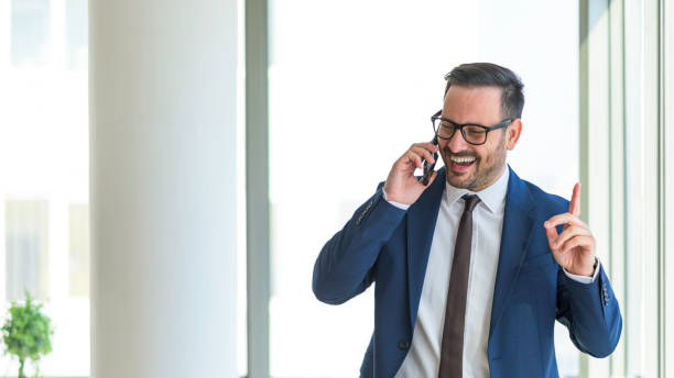 istock Happy businessman talking on his smart phone 1397261935