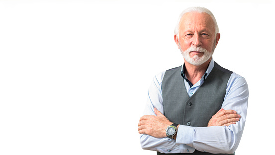 Portrait of smiling confident older business man or successful company owner with short stylish beard looking straight at the camera. Copy space