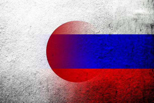 flaga narodowa federacji rosyjskiej z flagą narodową japonii. tło grunge'owe - flag russian flag russia dirty stock illustrations