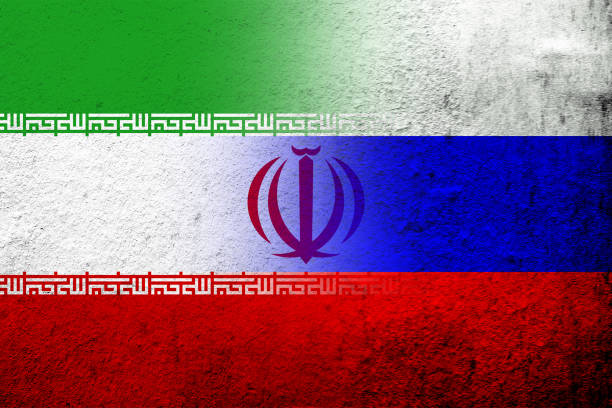 nationalflagge der russischen föderation mit der nationalflagge der islamischen republik iran. grunge-hintergrund - president of russia stock-grafiken, -clipart, -cartoons und -symbole