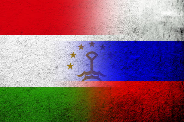 illustrazioni stock, clip art, cartoni animati e icone di tendenza di bandiera nazionale della federazione russa con la bandiera nazionale della repubblica del tagikistan. sfondo grunge - tagikistan