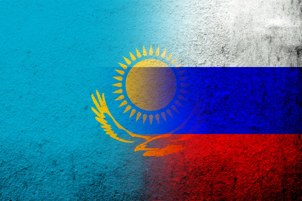 nationalflagge der russischen föderation mit der nationalflagge der republik kasachstan. grunge-hintergrund - kasachstan stock-grafiken, -clipart, -cartoons und -symbole
