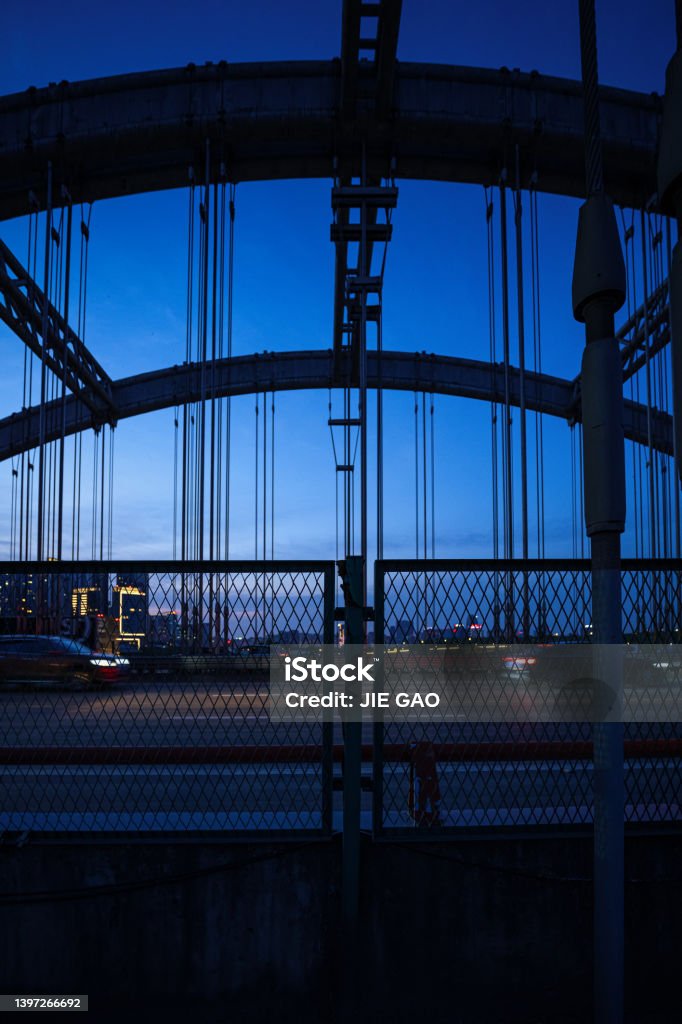 The city fence on the bridge at dusk Hurdle Stock Photo