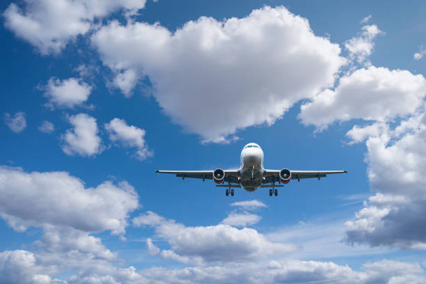 istock Flight of the passenger plane above the clouds. 1397267312