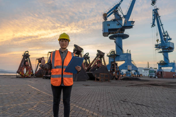 istock An Asian female engineer used to check data at the dock at dusk 1397268552