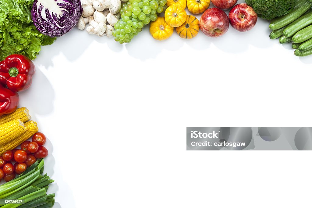 Fruits and vegetables disposed on a half frame shape Fruits and Vegetables Frame. White Copy Space. Vegetable Stock Photo
