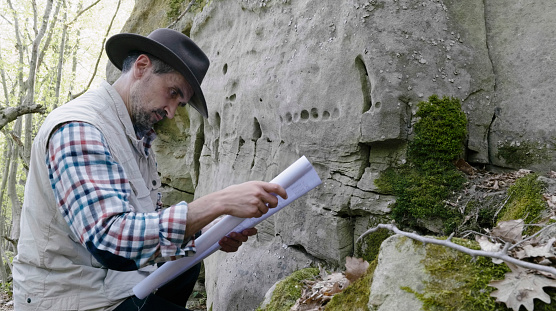 Exploring  petroglyphs in ancient rock dwellings and analysing the ancient drawings.