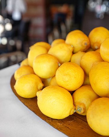 Group of fresh lemon on an old vintage plate