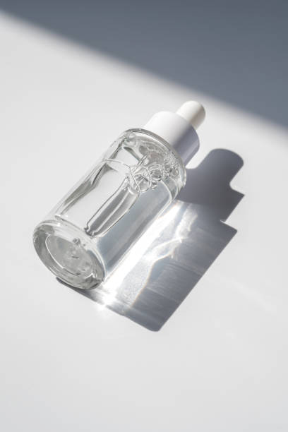 istock A white transparent bottle with serum in the rays of the sun. 1397270987