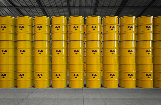 3d rendering group of yellow barrels with radiation hazard sign