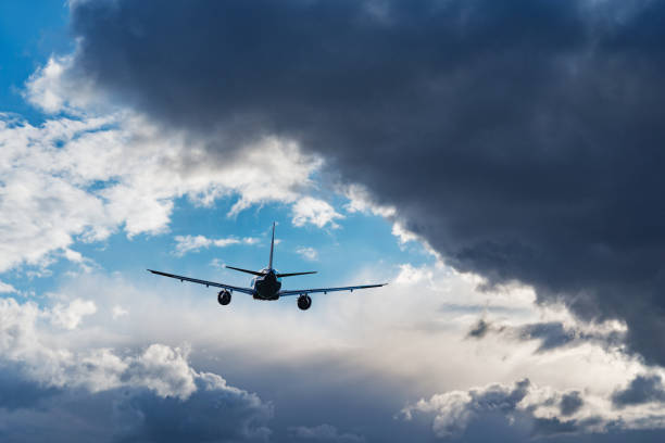 istock Flight of the passenger plane above the clouds. 1397275073