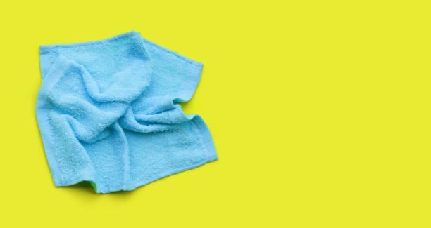 istock Blue towel for cleaning on green background. 1397275138