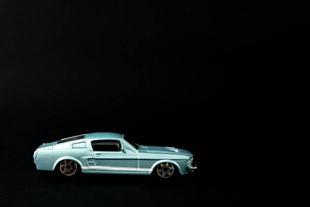 istock Old school classy composition, with metallic blue oldtimer. Classy, vintage concept on black background. 1397276559